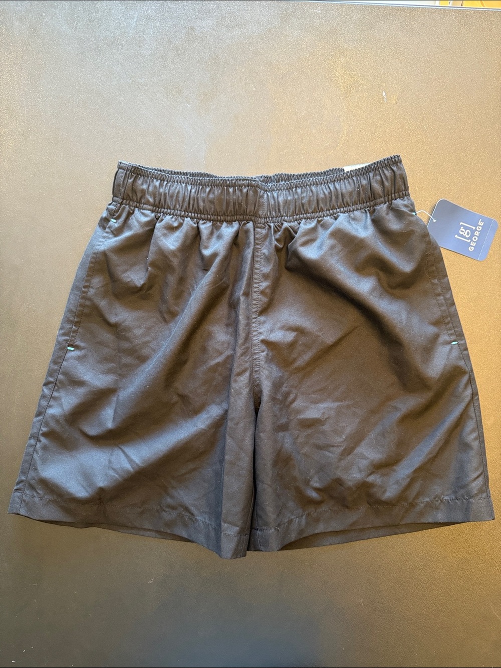 Men’s Black Swim Trunks Above the Knee